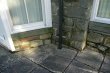 Before: Tired looking paving flags and green stained stonework
