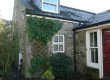 Before: Overgrown shrub and tired Stonework
