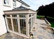 Example of a stunning cream orangery with a black lantern rooflight